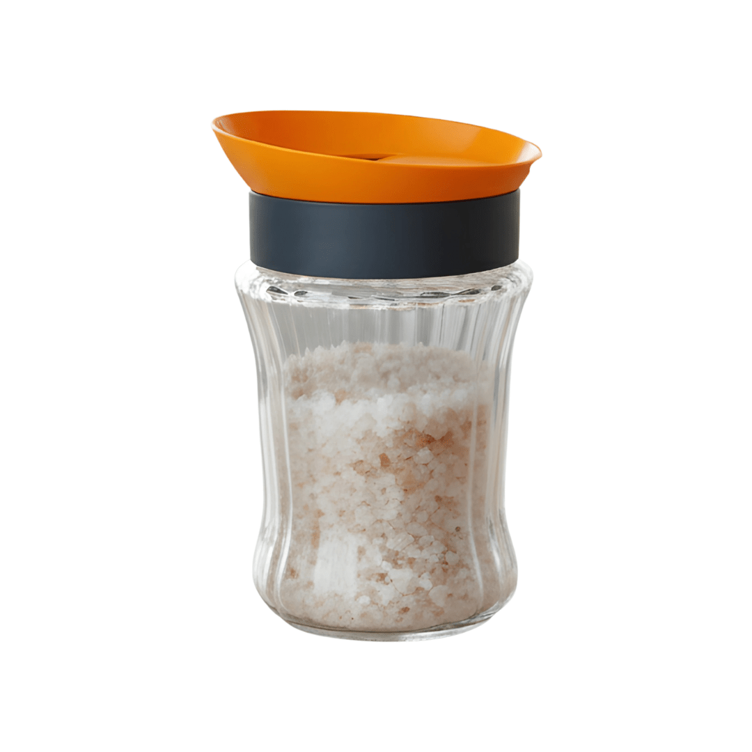 Three Herevin striped glass storage jars with green, orange, and pink rotating lids filled with coffee, salt, and spices.