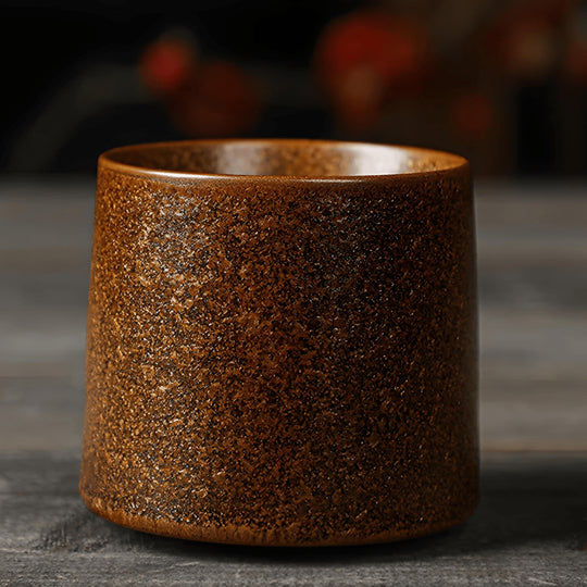 Brown textured ceramic espresso cup with rotating base