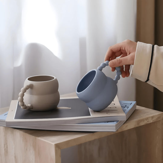 White ceramic mug with beaded handle on table – Elegant coffee cup Lebanon