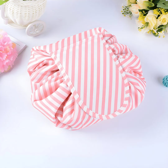 Pink striped TOPMOVE German-made foldable makeup bag with drawstring.