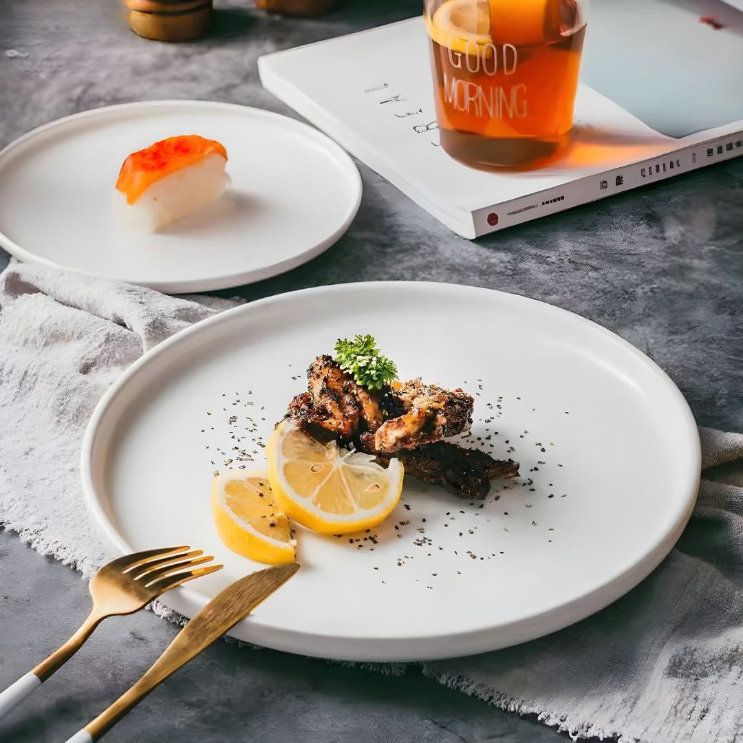 Elegant matte finish dinner plate in white and red-brown, modern minimalist design, available in Lebanon, durable and safe for microwave & dishwasher.