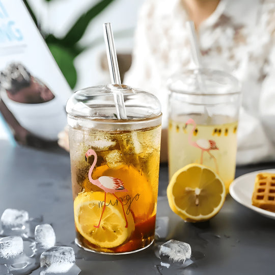 500ml borosilicate glass cups with lids and reusable straws, featuring trendy prints like bear, flamingo, and stars – perfect for iced coffee, juices, and smoothies in Beirut’s vibrant lifestyle.