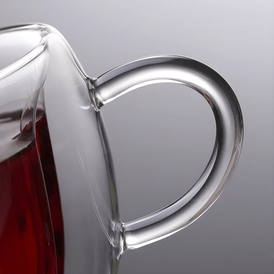 Close-up handle of heart-shaped double wall glass mug