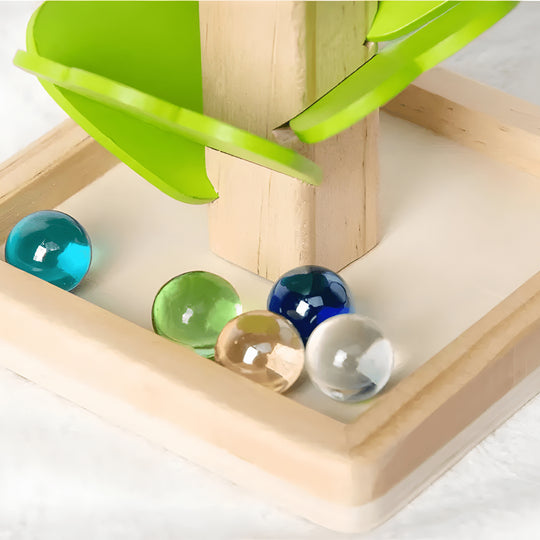 Montessori wooden marble tree toy with colorful leaves and marbles in the base, for ages 3+