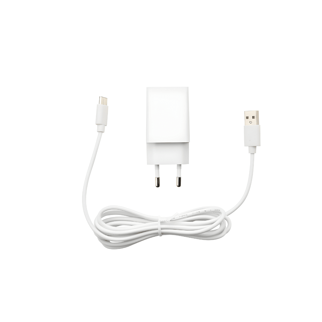 Silvercrest white ultrasonic aroma diffuser on a wooden table with cool mist rising, rechargeable Type-C aromatherapy device.