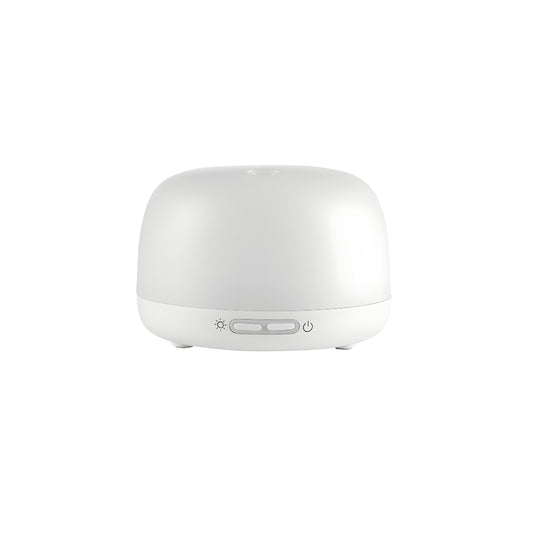 Silvercrest white ultrasonic aroma diffuser on a wooden table with cool mist rising, rechargeable Type-C aromatherapy device.