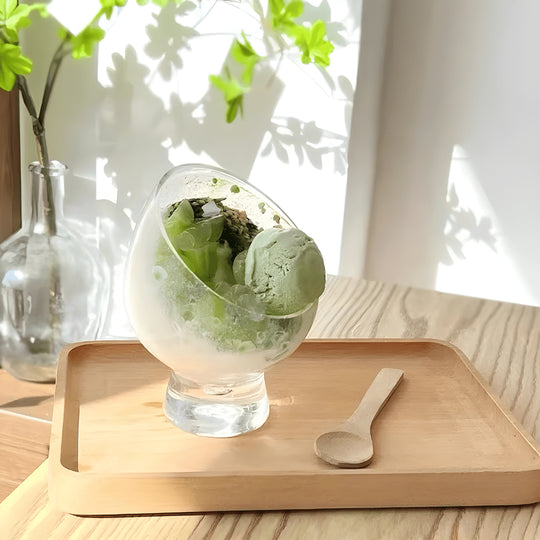 Clear tilted borosilicate glass dessert bowl with stand, 10.5×14cm – ideal for fruit salad, parfaits, and gourmet presentation.