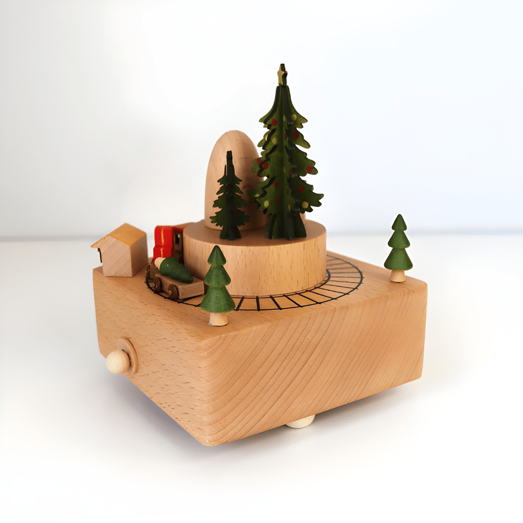 Handcrafted wooden Christmas music box with a rotating miniature train and snowy holiday scene.