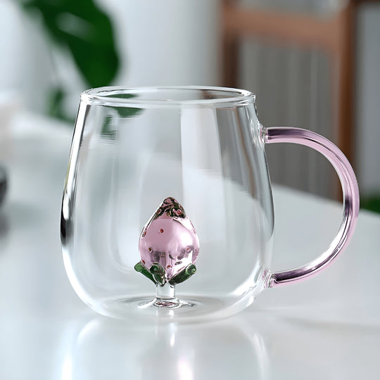 Clear borosilicate glass mug with pink 3D strawberry inside and ergonomic handle