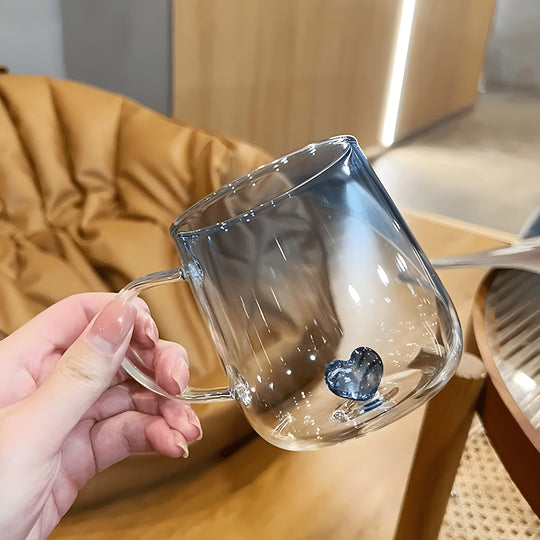 Transparent borosilicate glass cups with pink and blue heart designs, featuring gradient color and elegant handles – 400ml capacity.