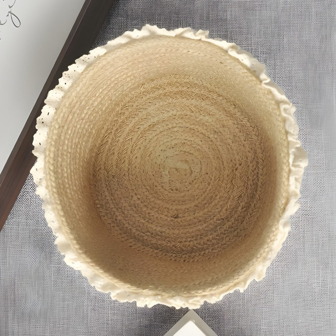 Lace-trimmed jute basket displayed in a cozy, modern interior with soft textures and neutral tones