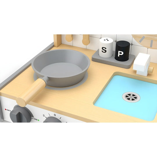 Full view of wooden toy kitchen playset with utensils, stove, sink, and wall clock