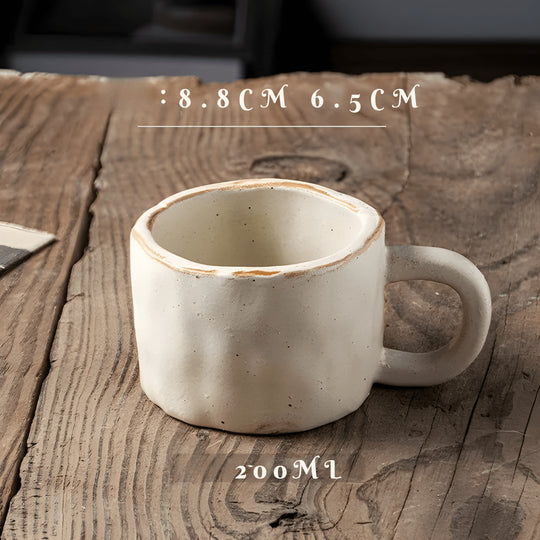 200ml Japanese-style hand-pinched ceramic mug with rustic finish, ideal for coffee or tea

