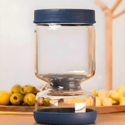 Uniq Essential Heritage 900ml hourglass jar for olives and pickles with blue lids.