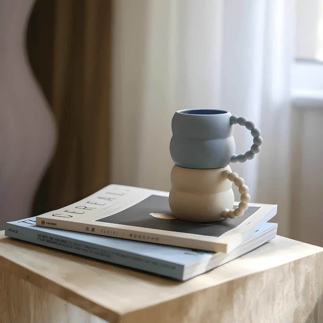 White ceramic mug with beaded handle on table – Elegant coffee cup Lebanon