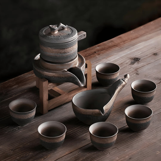 Handcrafted ceramic stoneware teapot set with cups and wooden base for traditional tea brewing