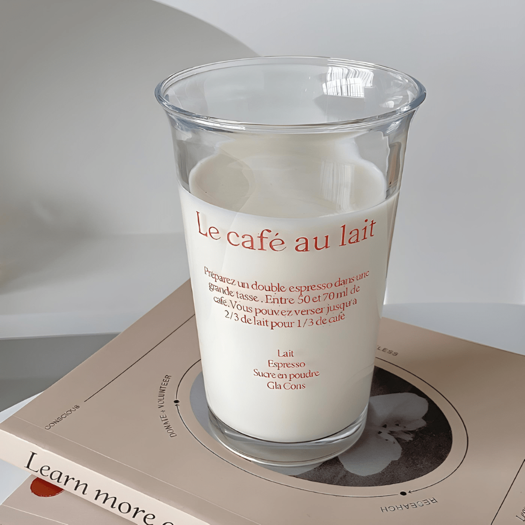 Korean-style 350ml clear glass tumbler with red or blue “Le café au lait” lettering, suitable for hot and cold drinks