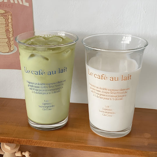 Korean-style 350ml clear glass tumbler with red or blue “Le café au lait” lettering, suitable for hot and cold drinks