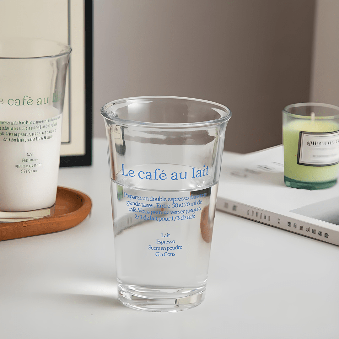 Korean-style 350ml clear glass tumbler with red or blue “Le café au lait” lettering, suitable for hot and cold drinks
