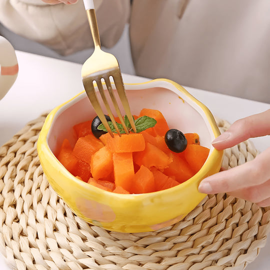 450ml yellow hand-pinched ceramic bowl filled with papaya, blueberries, and mint leaves.