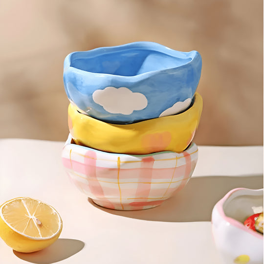 450ml yellow hand-pinched ceramic bowl filled with papaya, blueberries, and mint leaves.
