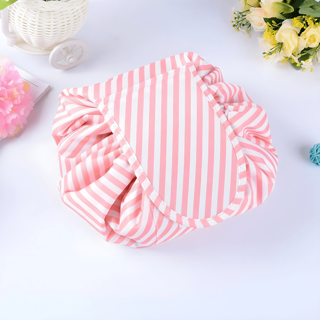 Pink striped TOPMOVE German-made foldable makeup bag with drawstring.