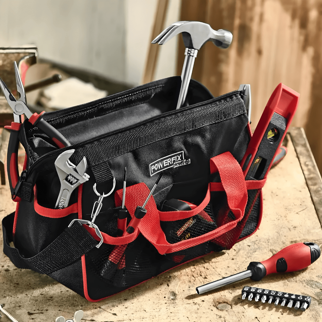 PARKSIDE® 23-piece tool set with pliers, screwdrivers, hammer, wrench, and tape measure in a compact storage bag for home and DIY repairs.