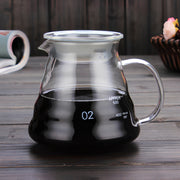 360ml clear glass coffee server with lid, curved handle and pouring spout, partially filled with coffee.