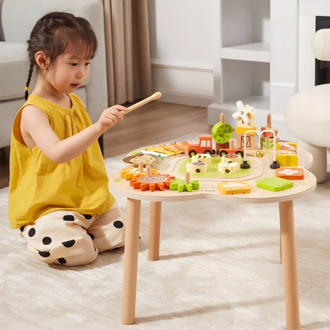 Wooden Montessori sensory activity table with puzzles, gears, bell, and train track — safe non-toxic paint, fun educational toy for toddlers, Beirut Lebanon.