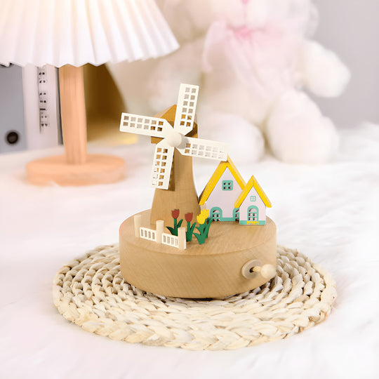 Handcrafted wooden windmill music box with rotating sails and natural wood finish, playing Castle in the Sky melody.