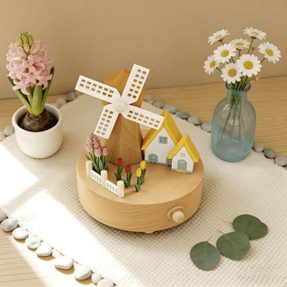 Handcrafted wooden windmill music box with rotating sails and natural wood finish, playing Castle in the Sky melody.
