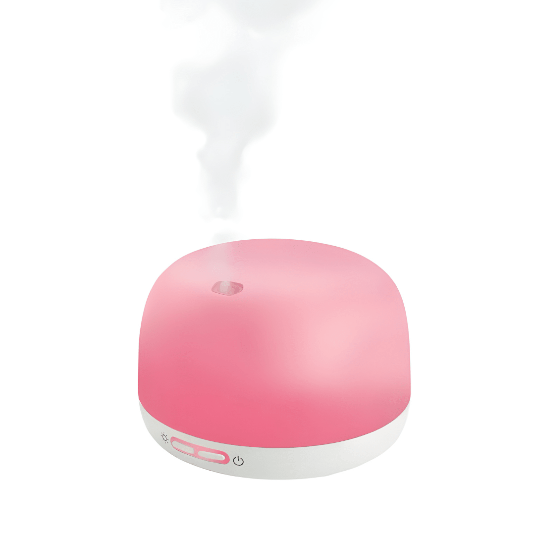 Silvercrest white ultrasonic aroma diffuser on a wooden table with cool mist rising, rechargeable Type-C aromatherapy device.