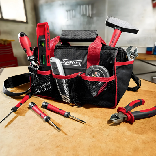 PARKSIDE® 23-piece tool set with pliers, screwdrivers, hammer, wrench, and tape measure in a compact storage bag for home and DIY repairs.