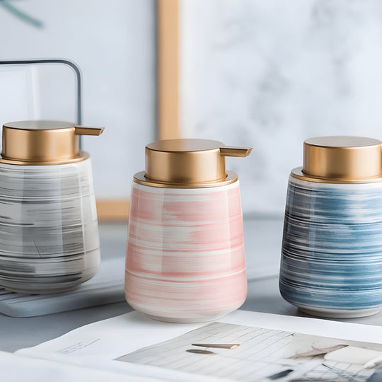 Matte white Nordic ceramic shampoo dispenser 430ml with silver pump on a modern bathroom shelf.