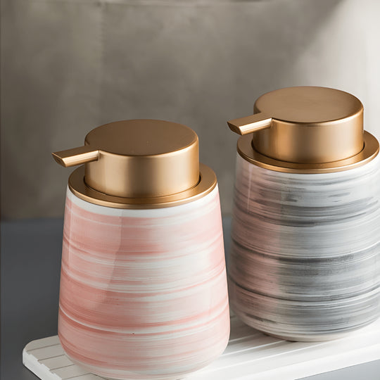 Matte white Nordic ceramic shampoo dispenser 430ml with silver pump on a modern bathroom shelf.