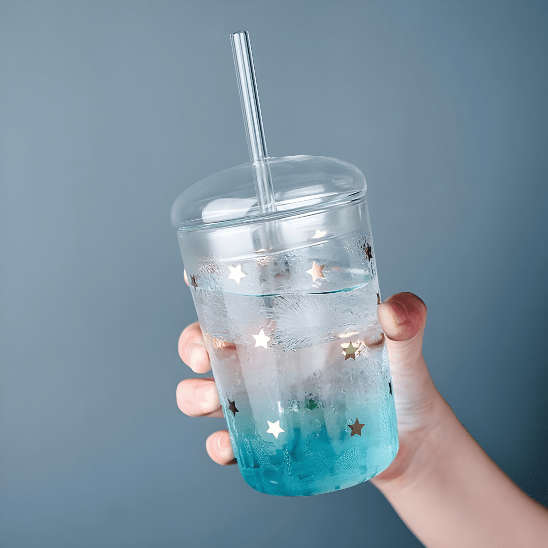 500ml borosilicate glass cups with lids and reusable straws, featuring trendy prints like bear, flamingo, and stars – perfect for iced coffee, juices, and smoothies in Beirut’s vibrant lifestyle.