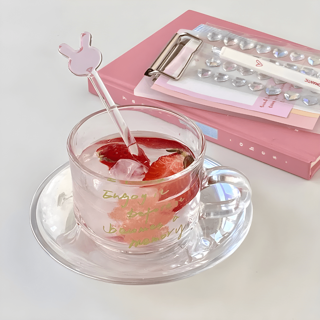 Clear 200ml glass cups with saucers and stirrers, each with a motivational quote and unique stirrer design – perfect for hot or cold beverages in Beirut.

