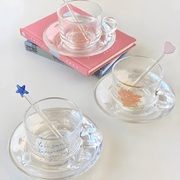 Clear 200ml glass cups with saucers and stirrers, each with a motivational quote and unique stirrer design – perfect for hot or cold beverages in Beirut.

