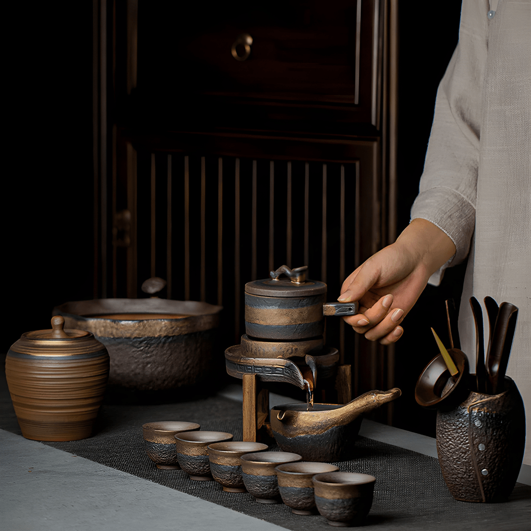 Handcrafted ceramic stoneware teapot set with cups and wooden base for traditional tea brewing