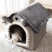 Grey plush dog and cat house with soft roof, detachable parts, non-slip bottom, and adorable cartoon ear design – available in S and L sizes.

