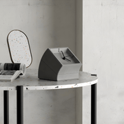 High-end minimalist concrete desk clock with matte finish and hidden storage, available in gray and white – sculptural design for luxury interiors