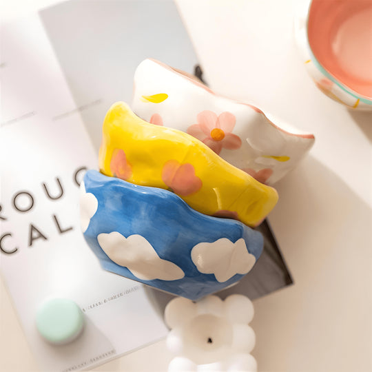 450ml yellow hand-pinched ceramic bowl filled with papaya, blueberries, and mint leaves.