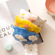 450ml yellow hand-pinched ceramic bowl filled with papaya, blueberries, and mint leaves.