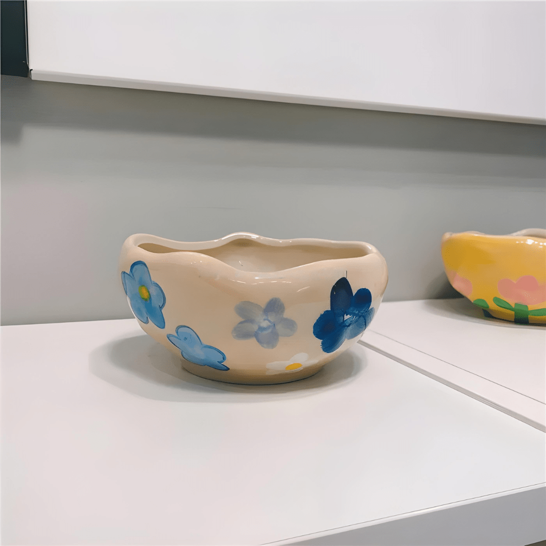 450ml yellow hand-pinched ceramic bowl filled with papaya, blueberries, and mint leaves.