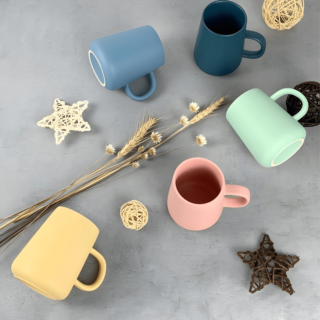 Scandinavian-style 340ml matte ceramic mugs in green, blue, and dark blue colors