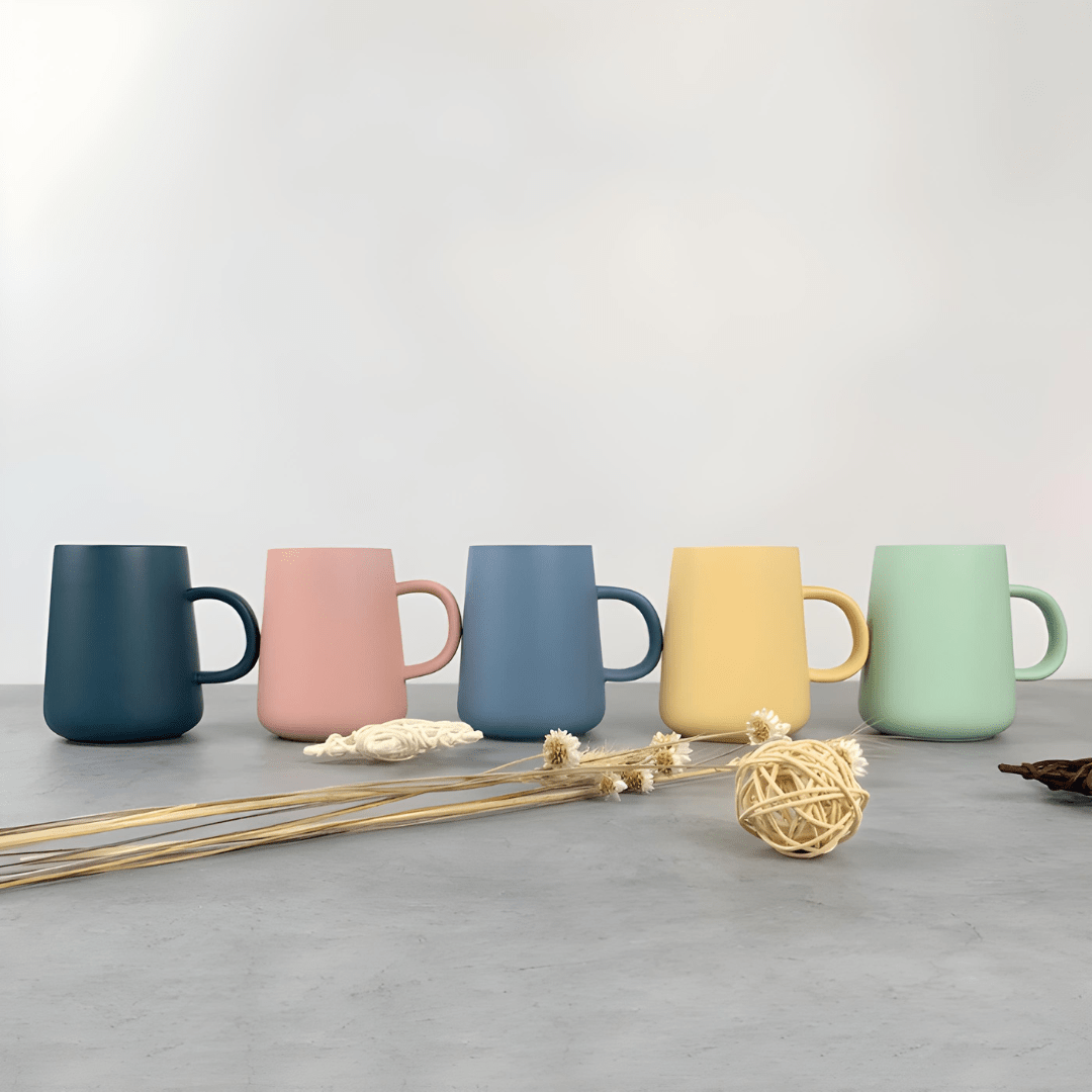 Scandinavian-style 340ml matte ceramic mugs in green, blue, and dark blue colors