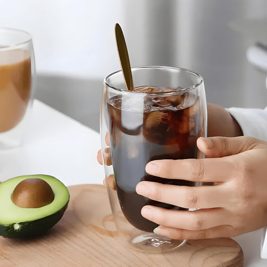 450ml double wall glass filled with iced coffee held in hands