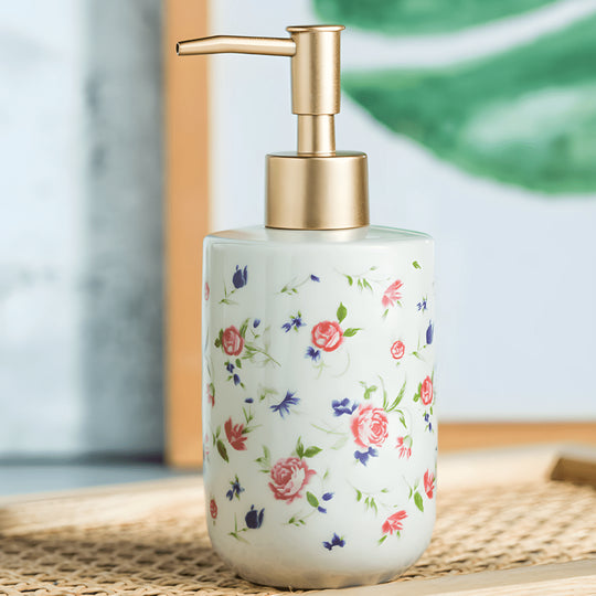 Retro white soap dispenser with golden pump and rose design – Beirut Lebanon