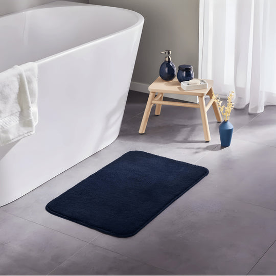 Blue LIVARNO Home Bath Mat 45×70 cm placed beside bathtub