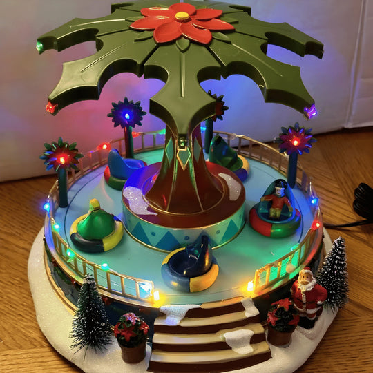 St. Nicholas Square illuminated amusement park Christmas village 2023 with Santa, lights, music, and motion. Hand-painted festive collectible for Beirut homes.